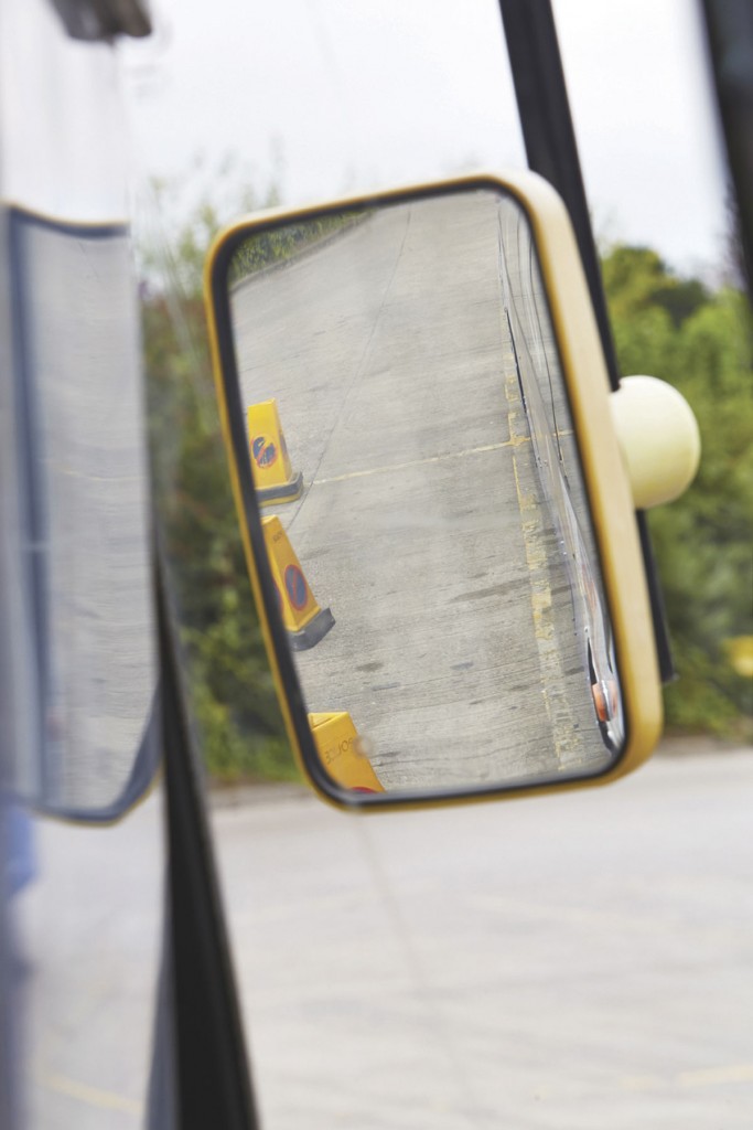 With the girl still in the same position as she was from the first image, here we can see the view in a conventionally fitted mirror. She is clearly out of sight. Some mirrors on buses have an even smaller viewing field than this.