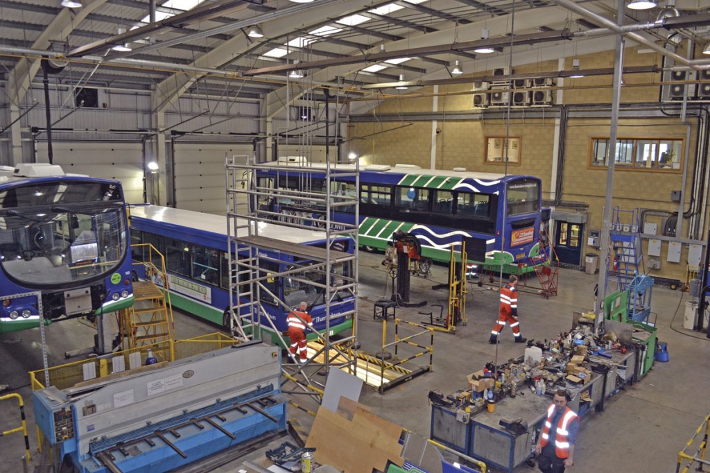 An aerial photograph of the main workshop showing a number of vehicles requiring work.