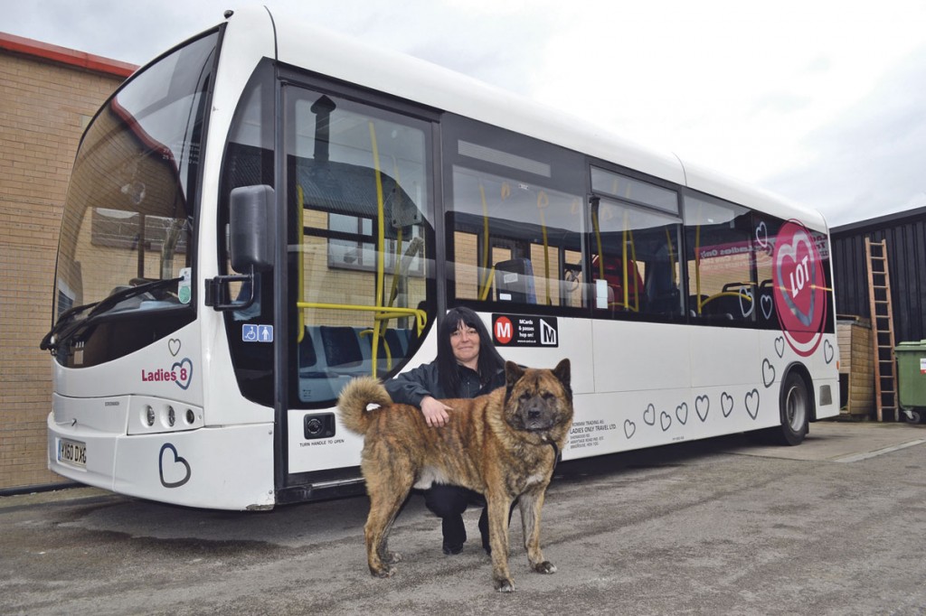 Jeanette and her American Akita in front of one of her ‘ladies’ – this one being number 8. The hearts ‘show we care’