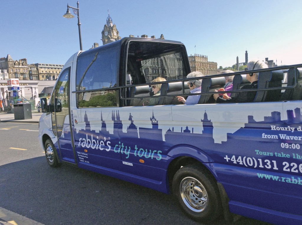 Passengers enjoying the open roof on the EVM Cabrio on the very first Rabbie’s Edinburgh City Tour