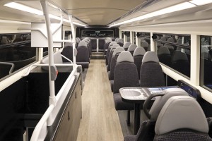 The upper deck includes two tables and a lounge area