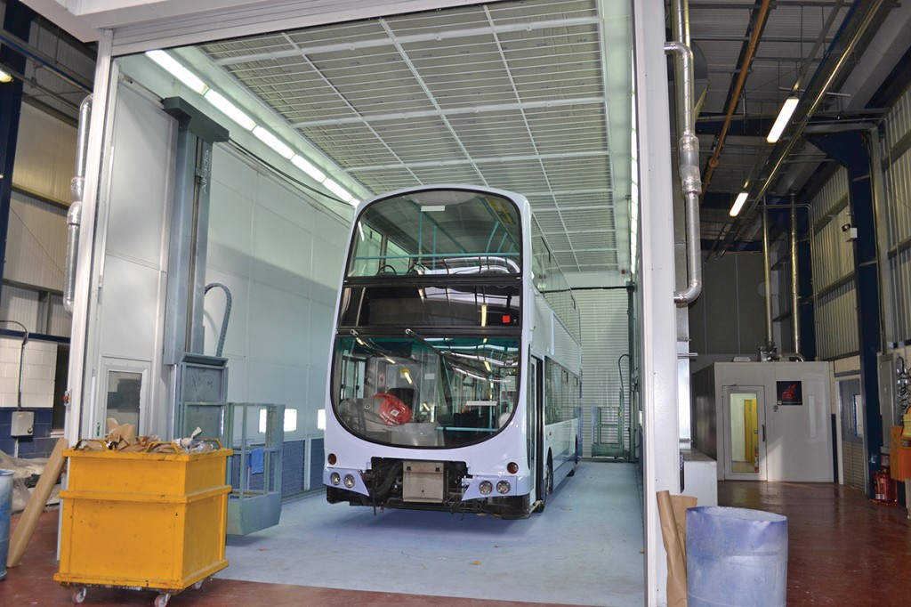 This bus will take about 48 hours to dry. To the right of the booth is the paint mixing room.