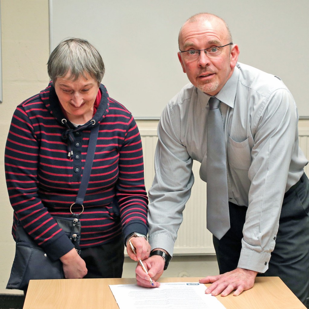 Bus Passenger Champion for Birmingham, Sharon Gibbs, and National Express West Midlands Head of Training and Recruitment, Mark Simcox, sign the Bus Charter