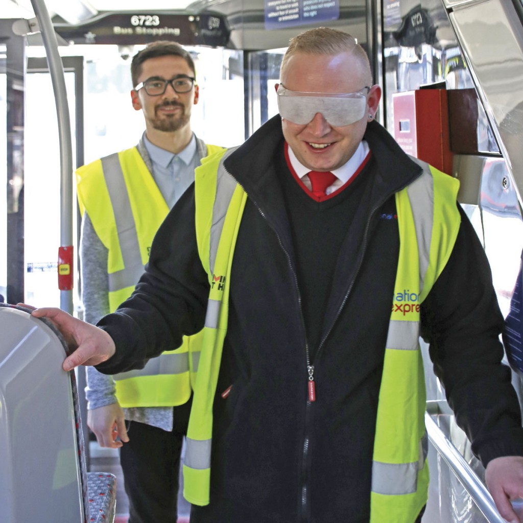 Driver trainer Carlton Edwards feels his way onboard wearing full cataract sim specs