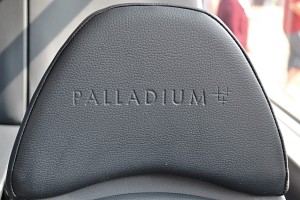 The lower salon with glass walled stairwell, wheelchair space and comfortable seating Inset Embossed seat - This E-Leather seating has been embossed with the Palladium brand