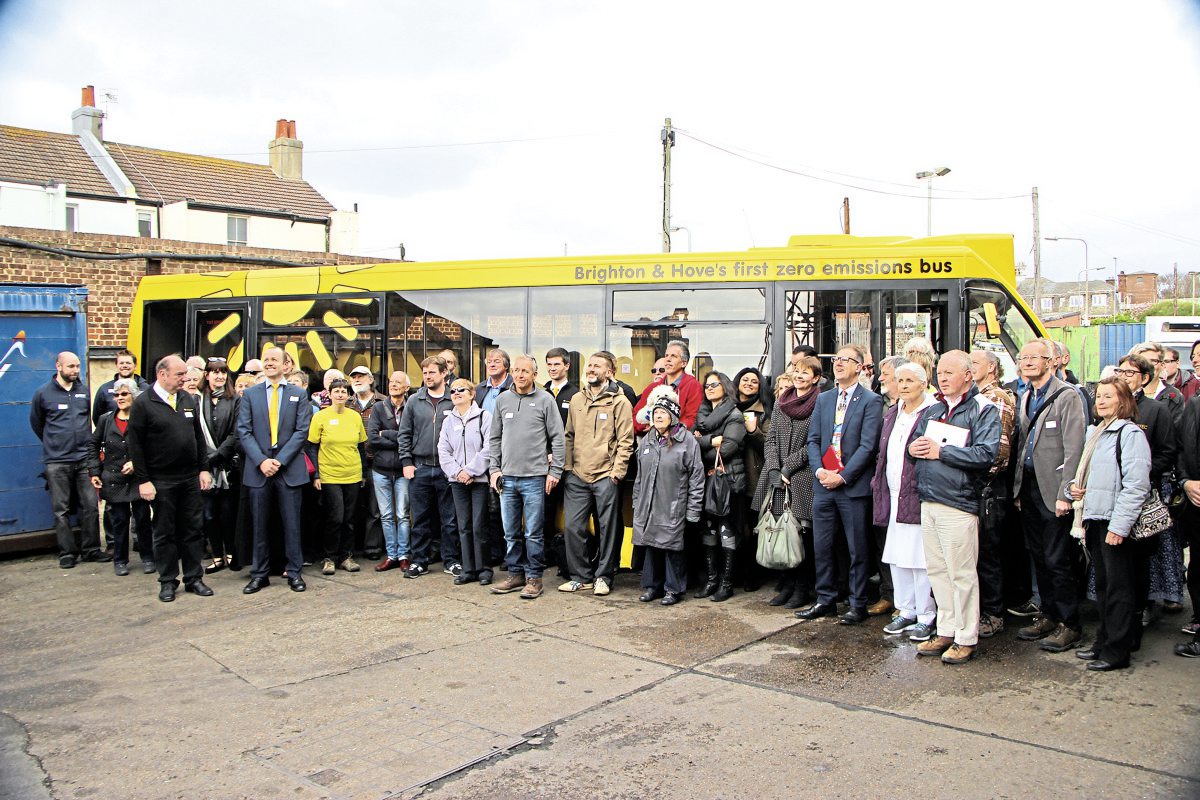 The solar powered bus, the Big Lemon team and some of their many guests celebrate the launch of the service