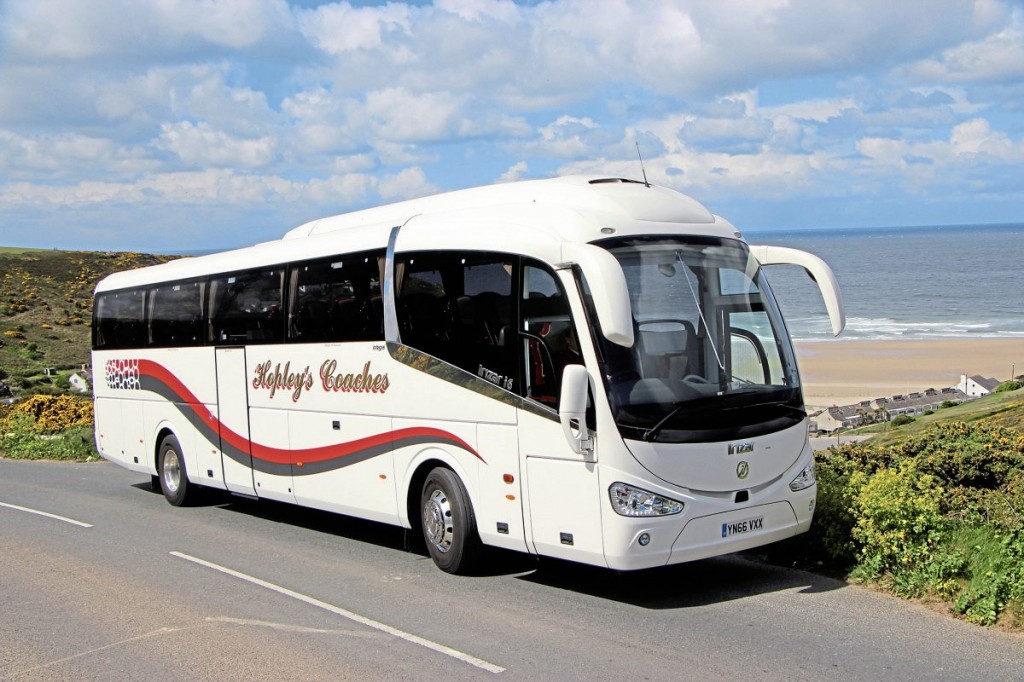 Hopley’s new Irizar i6 integral with Porthtowan beach visible behind it