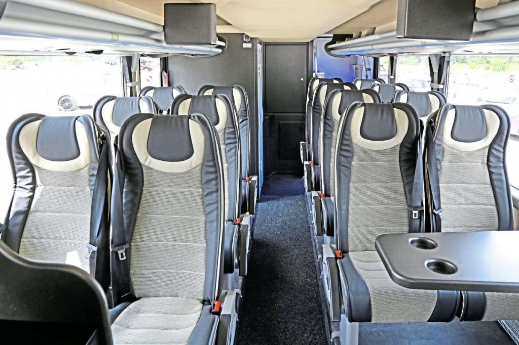 The lower deck with 16 MVT seats, toilet and two rack mounted monitors