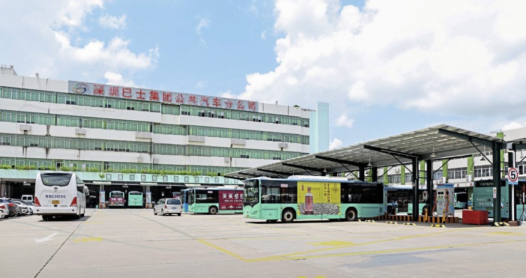 Shenzhen Bus Group’s Xiang Meibei large depot with BYD buses charging beneath the solar-panelled roof of the charging station