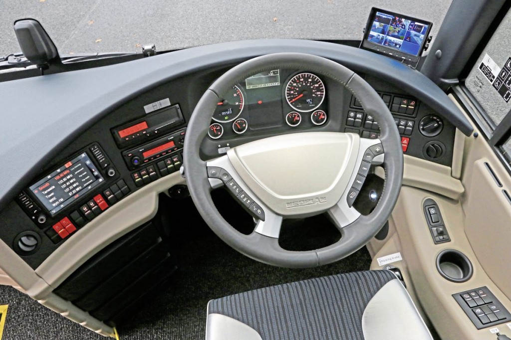 The new Tourliner dash with coloured displays together with the CCTV monitor added by AD Coach Systems