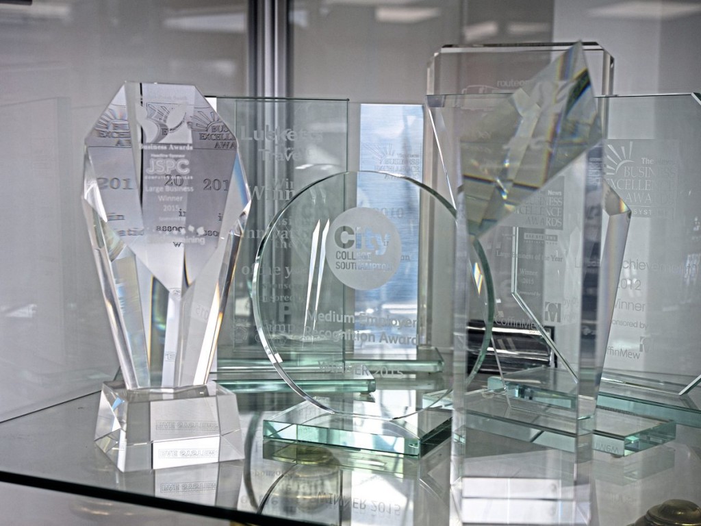 Glassware and trophies shown with pride in the waiting room include awards from National Express