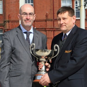 Billy Brayford of Robinsons collects his trophy from Traffic Commissioner Kevin Rooney