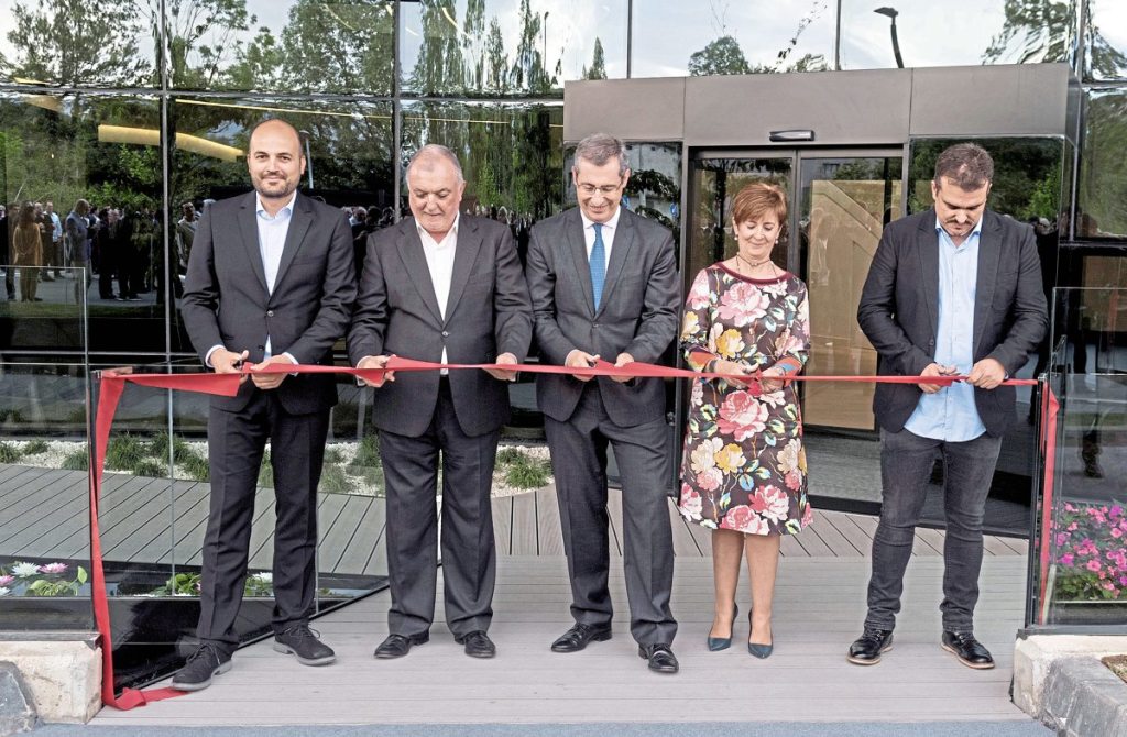 Cutting the ribbon to declare the new plant officially open