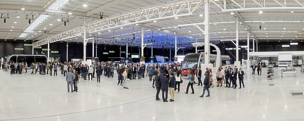 Guests mingle in the factory before the festivities begin