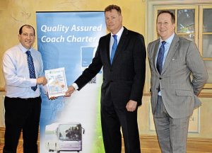 (L to R) Paul Marshall receiving his certificate into the Guild from Guild Chairman, Andrew Richmond, in the presence of Senior Traffic Commissioner, Richard Turfitt, who addressed members at the Guild’s most recent AGM