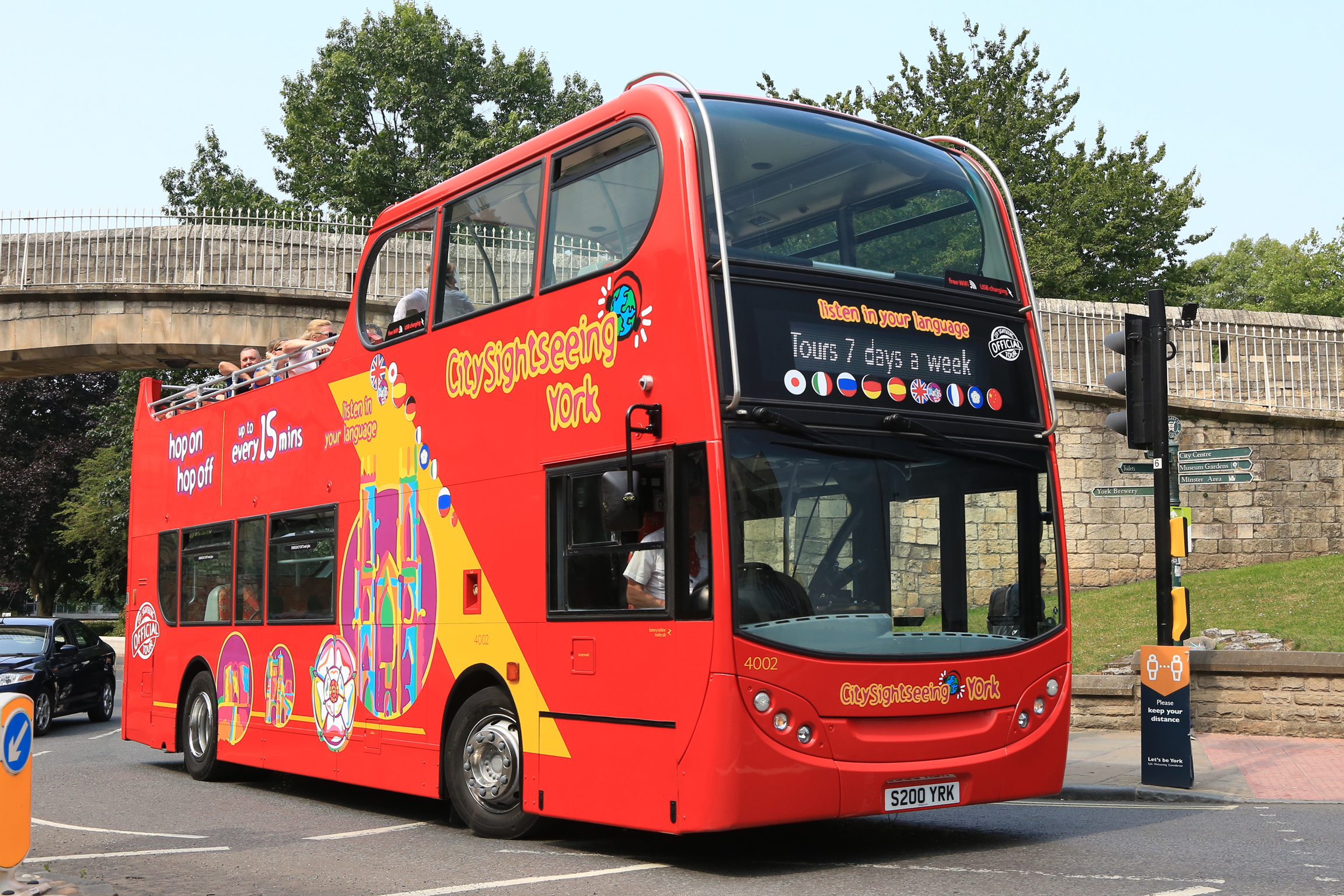One of Transdev’s newly converted vehicles passing through York’s city wall