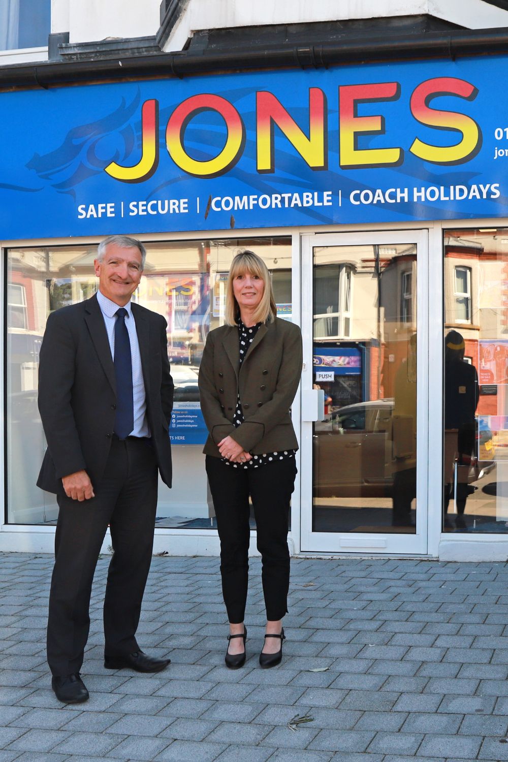 MD Chris Owens with Head of Sales and Marketing, Beverley Cooke, outside the new Jones Holidays shop in Craig-y-don, Llandudno