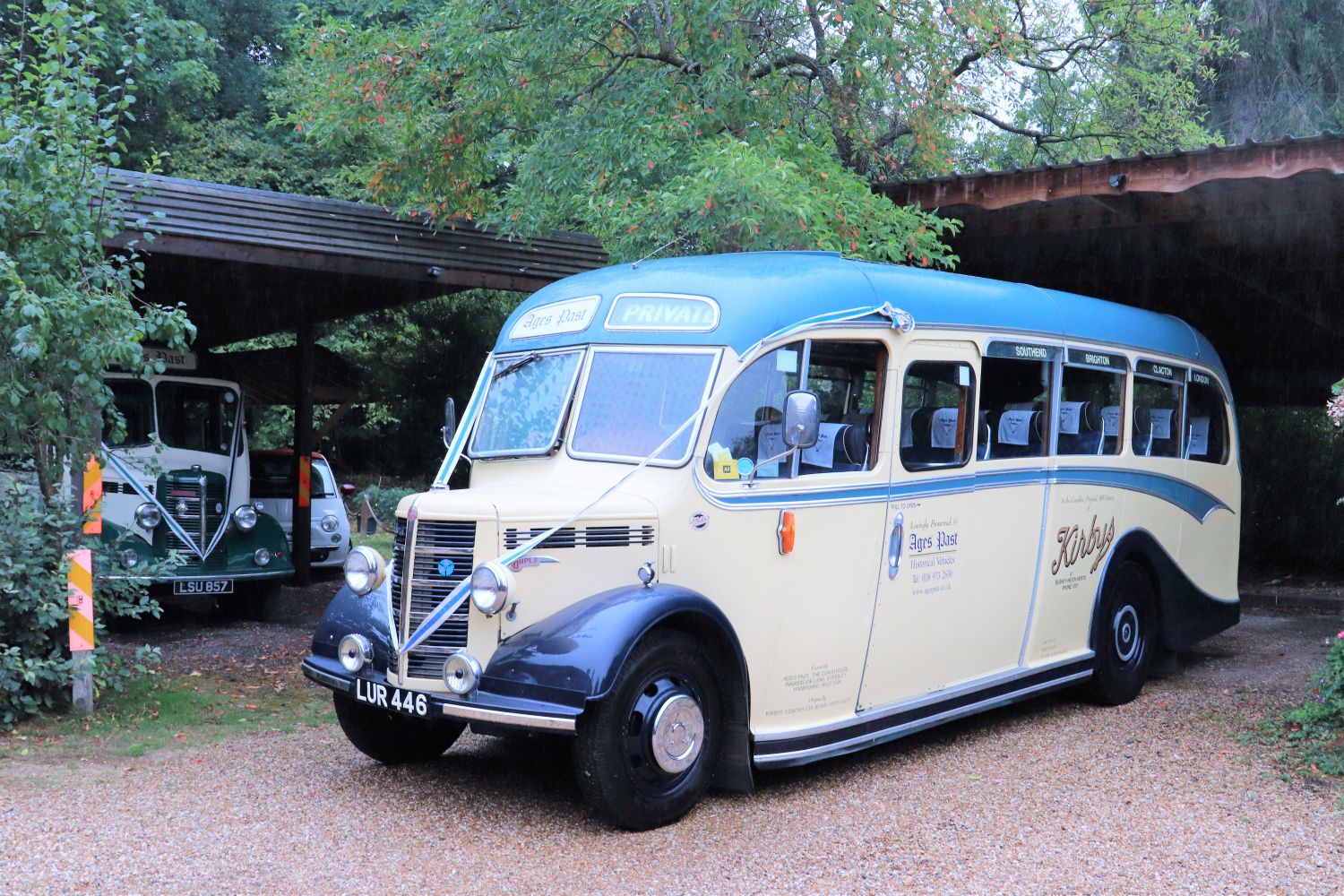 The youngest member of Ages Past’s OB fleet was delivered in September 1950 to T.H.Kirby of Bushey Heath and is presented in their colours. The last of the five Mark acquired, it is seen emerging from its garage with the Mulliner OB visible in its home to the rear