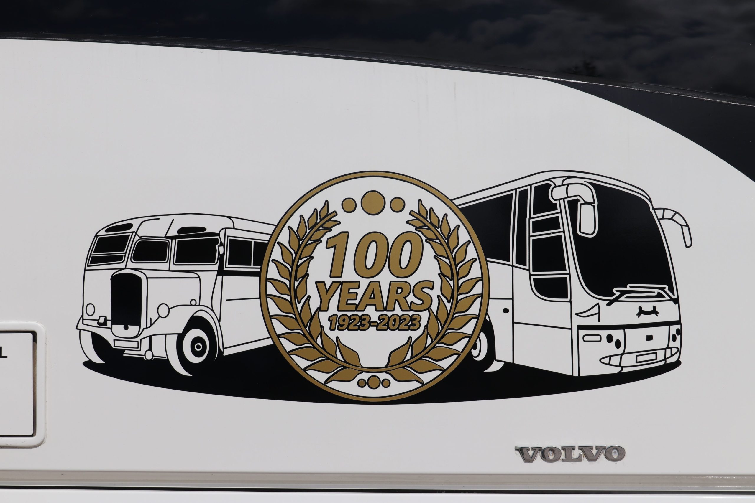 The centenary logo showing a Plaxton from the current fleet alongside a Thurgood Bodied Dennis Lancet that was one of only two coaches ever purchased new